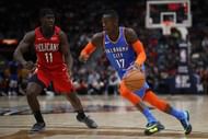 Jrue Holiday defending Dennis Schroder